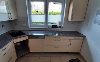 Küche in Bottrop mit Granit Arbeitsplatten Paradiso Chiaro