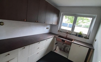 L-Küche in Köln mit Laminam Arbeitsplatten Bruno