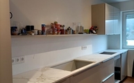 Moderne Küche in Kelkhem mit Entzo Dekton Arbeitsplatten und Rückwänden