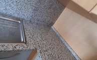 Küche in Köln mit Bianco Sardo Granit Arbeitsplatten 