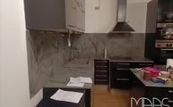 Küche in Wien mit Wassabi Granit Arbeitsplatten und Rüwände